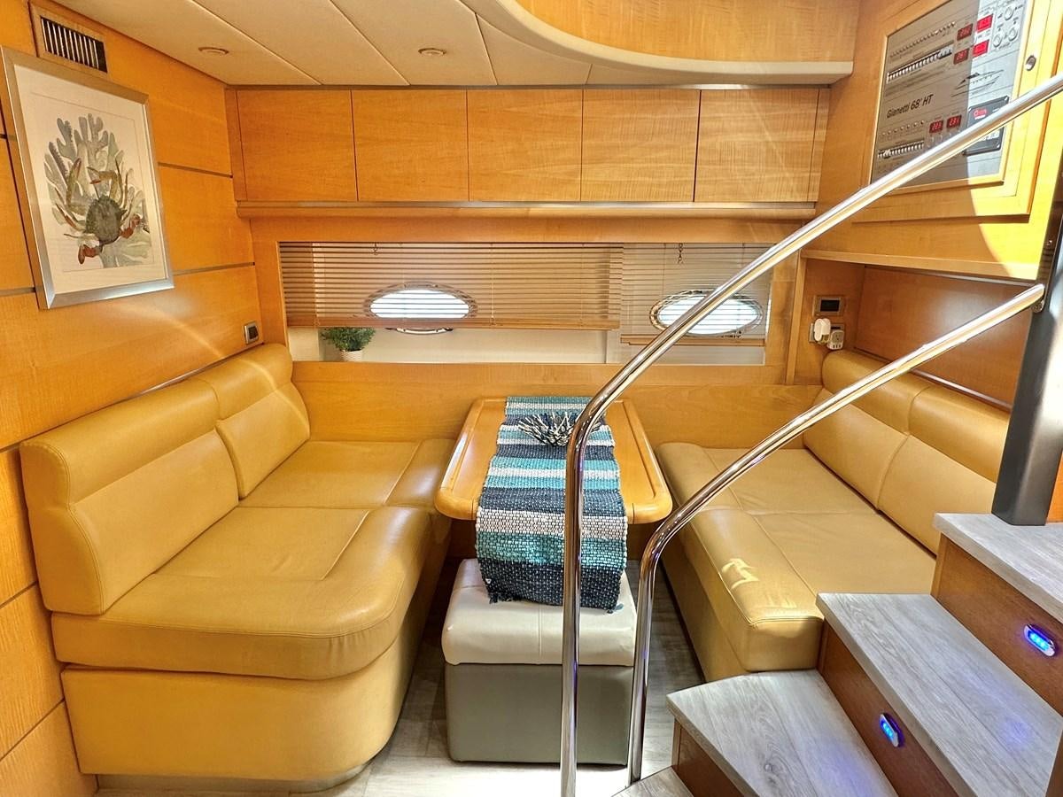 a room with a couch and a chair aboard NOTORIUS Yacht for Sale