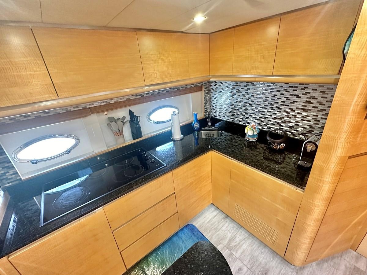 a kitchen with a marble counter top aboard NOTORIUS Yacht for Sale