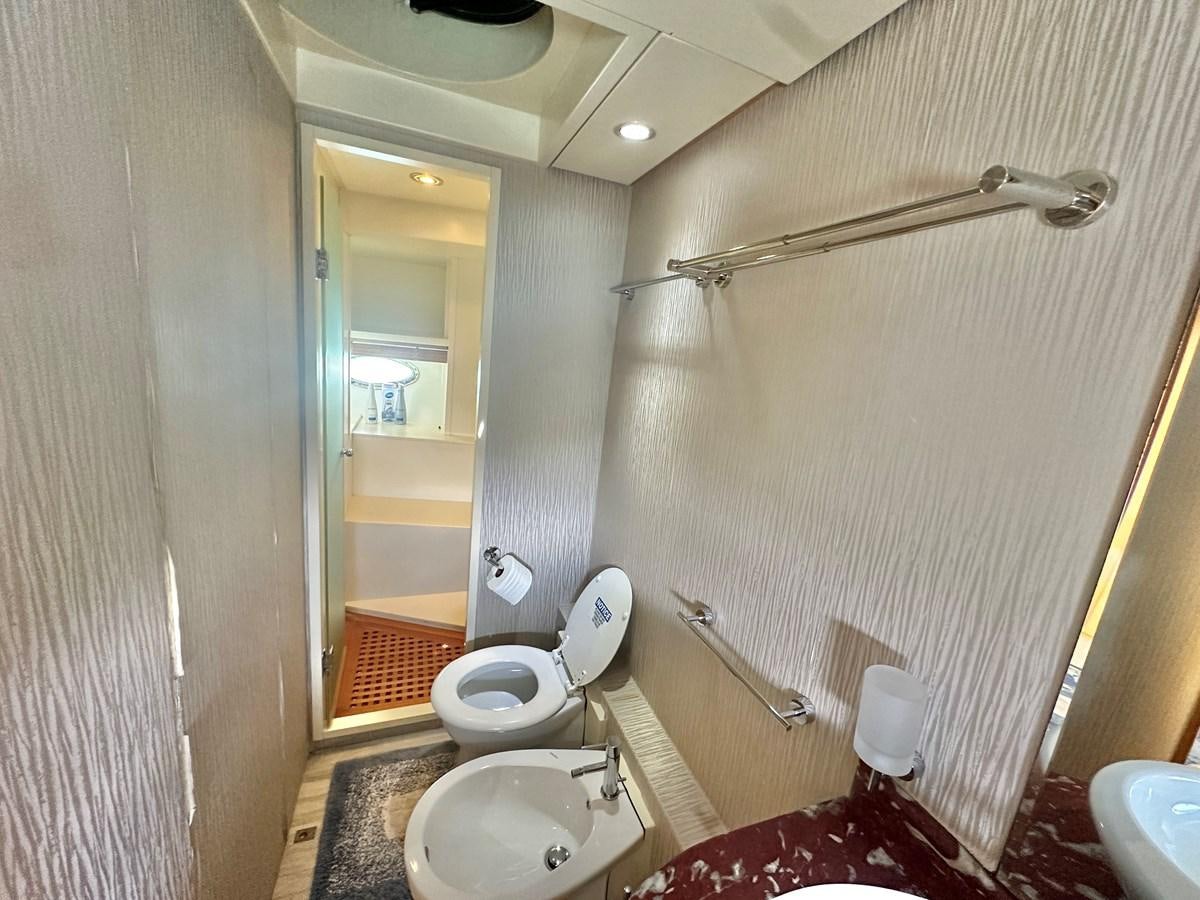 a bathroom with a toilet and sink aboard NOTORIUS Yacht for Sale