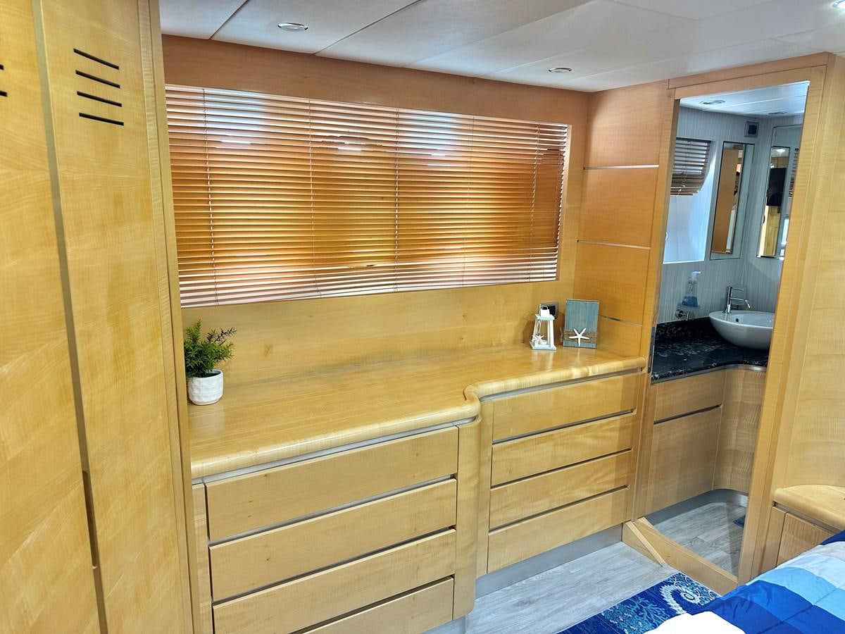 a bathroom with wooden cabinets aboard NOTORIUS Yacht for Sale