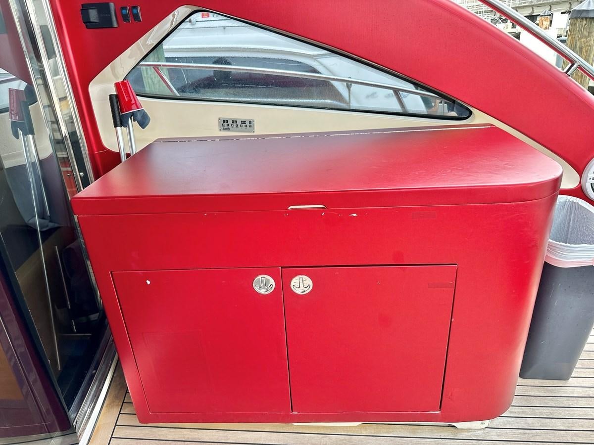 a red car with a white door aboard NOTORIUS Yacht for Sale
