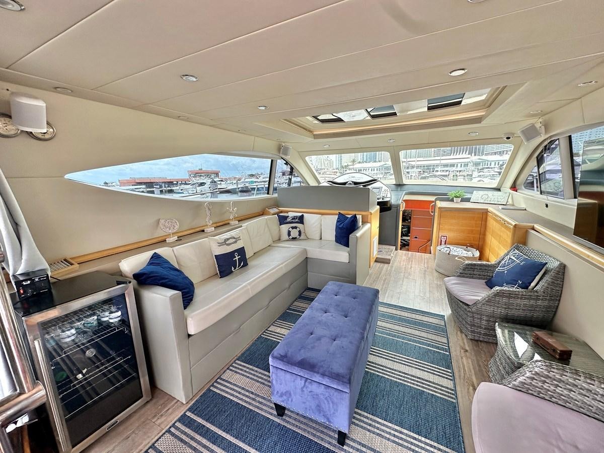 a boat with a couch and a television aboard NOTORIUS Yacht for Sale