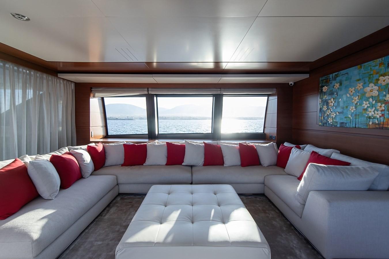 a couch with pillows and a bed aboard SWEET LANE Yacht for Sale