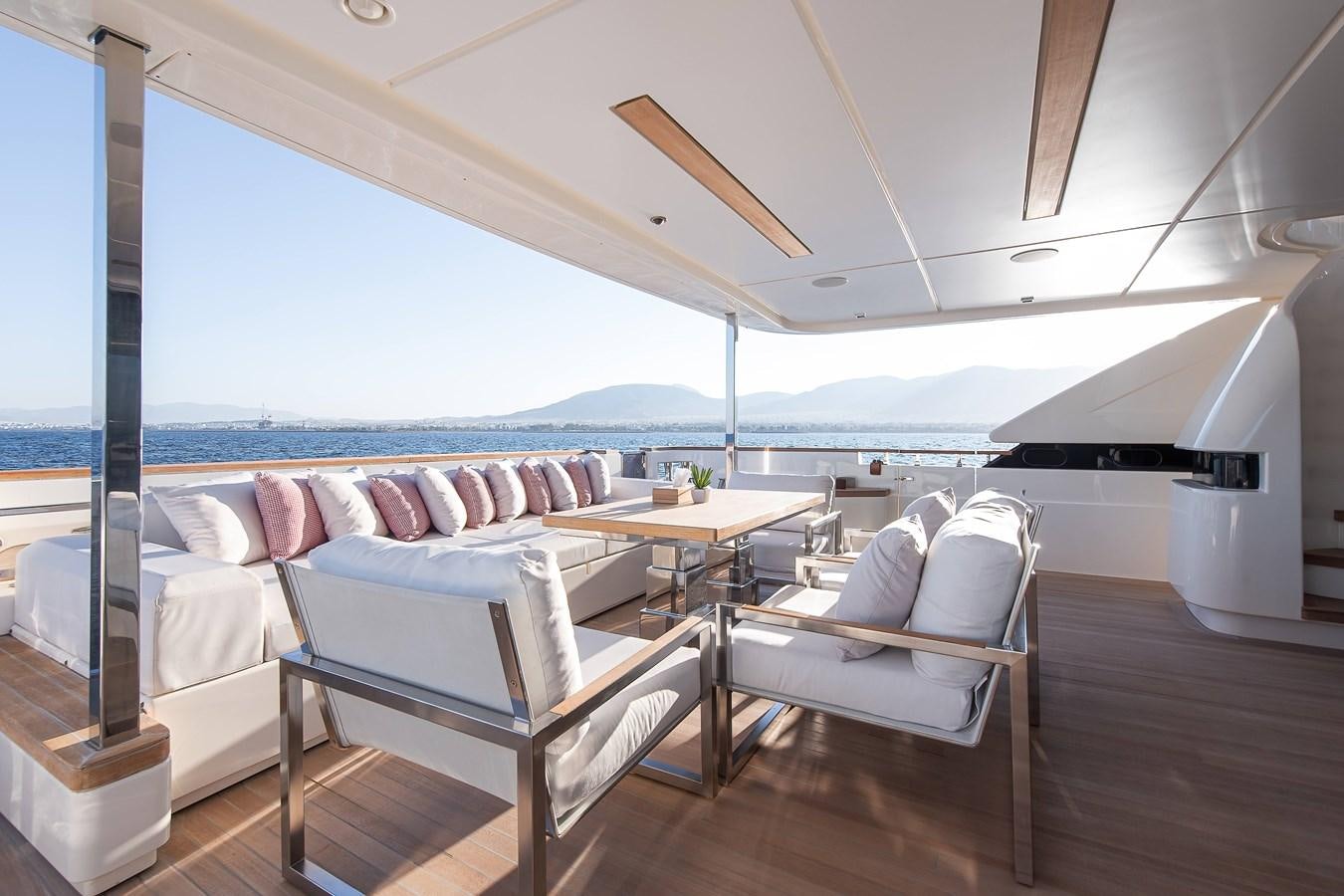 a room with a bed and a table aboard SWEET LANE Yacht for Sale