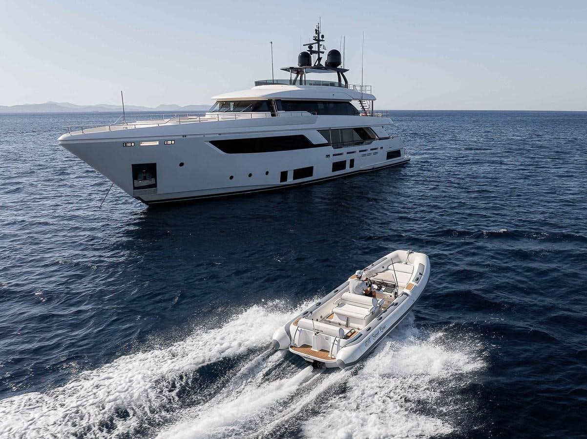 a boat and a motor boat in the water aboard SWEET LANE Yacht for Sale