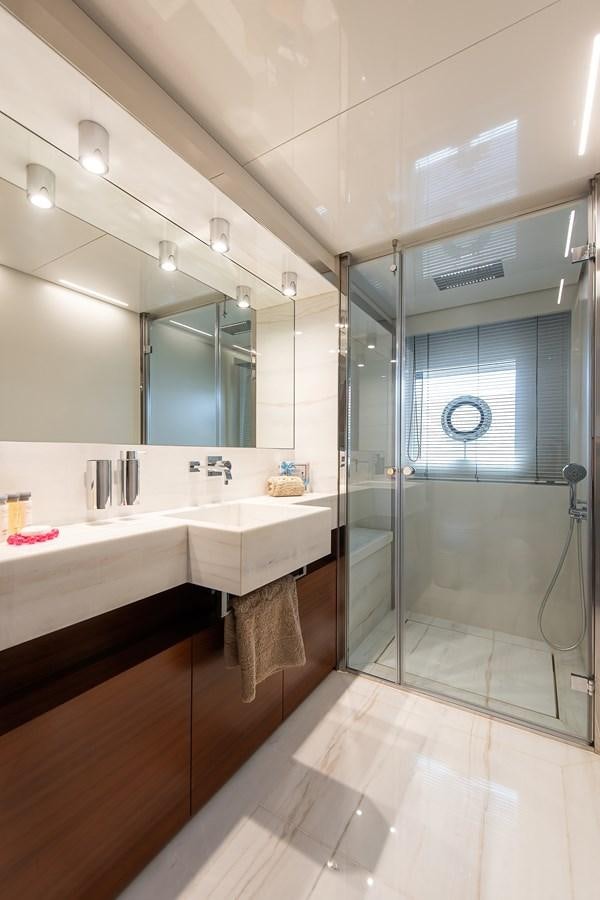 a bathroom with a glass shower aboard SWEET LANE Yacht for Sale