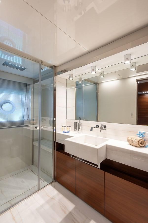 a bathroom with a glass shower aboard SWEET LANE Yacht for Sale