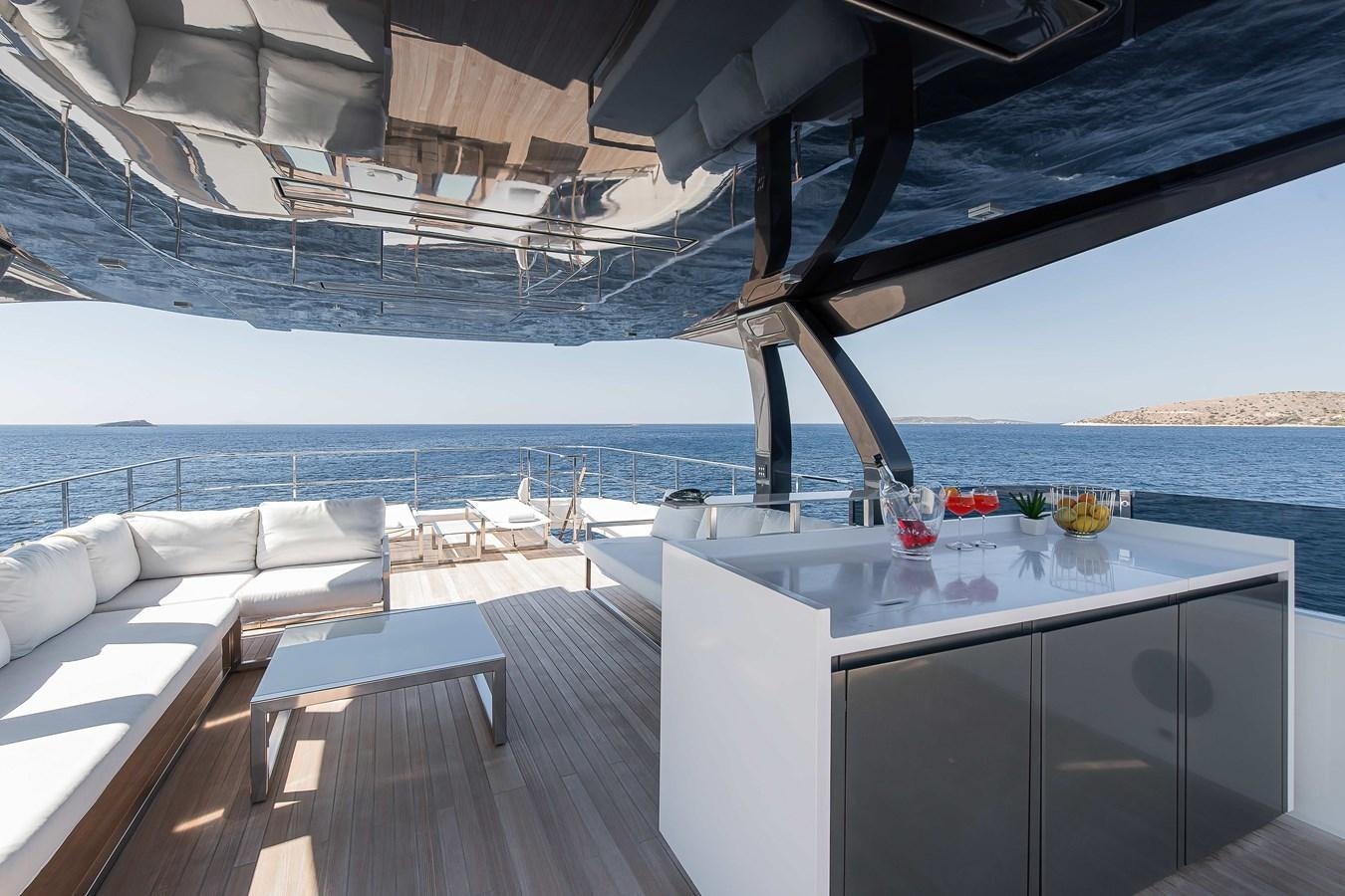 a deck with a view of the ocean and the deck aboard SWEET LANE Yacht for Sale