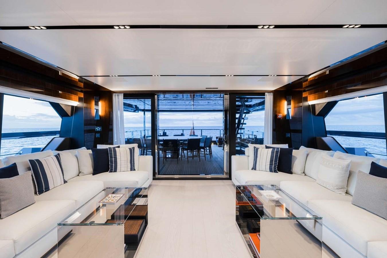 a living room with a large window aboard HULL #02 Yacht for Sale