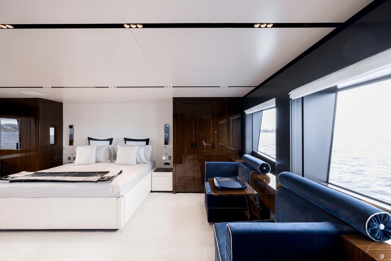a room with a bed and a desk aboard HULL #02 Yacht for Sale