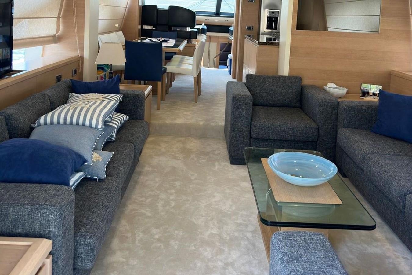 a living room with a couch and a coffee table aboard AZIMUT 84/12 Yacht for Sale
