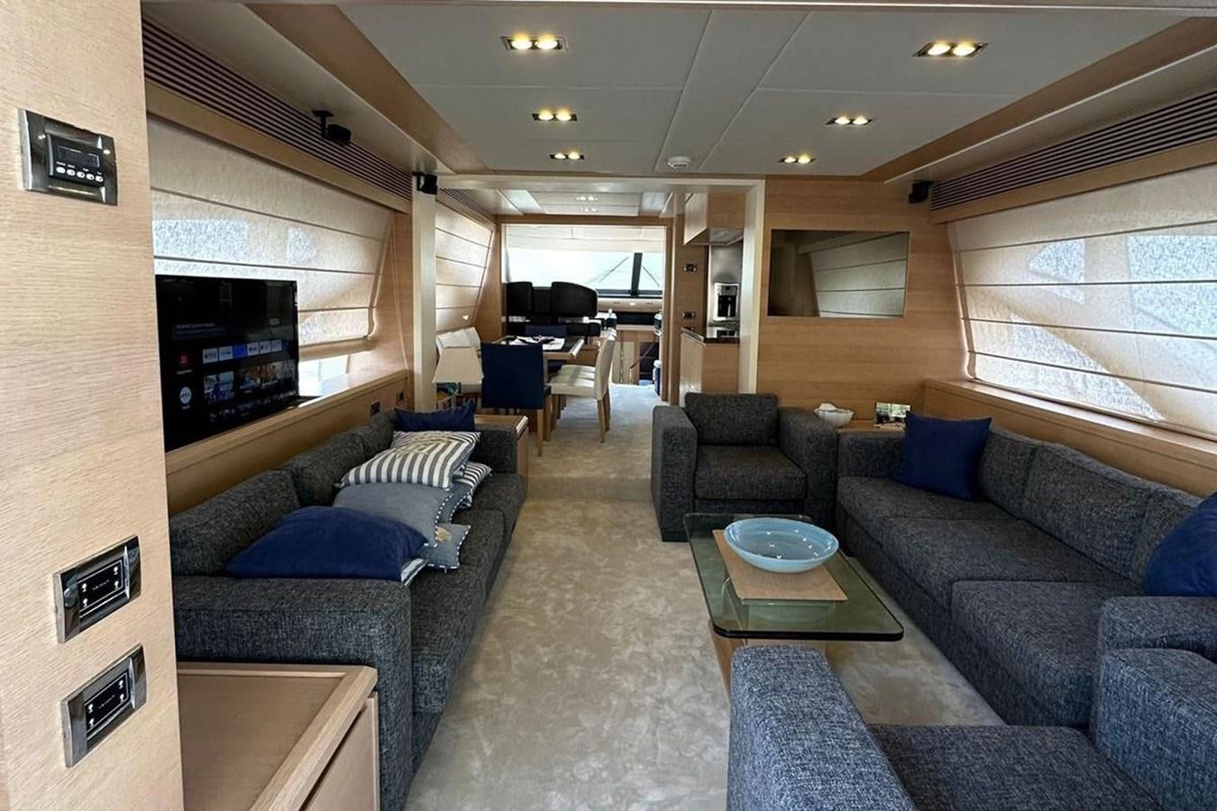 a living room with a couch and a coffee table aboard AZIMUT 84/12 Yacht for Sale