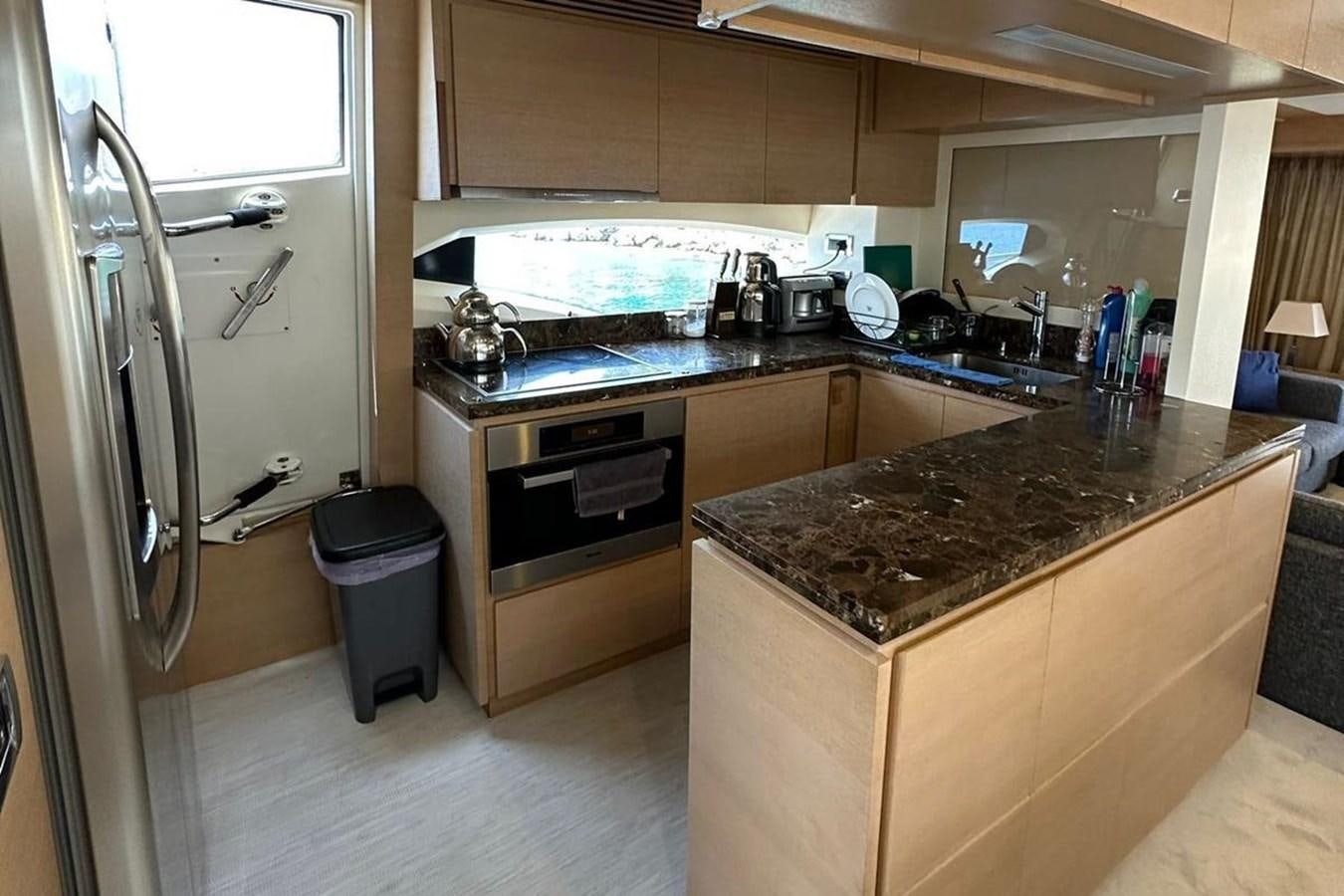 a kitchen with a large island aboard AZIMUT 84/12 Yacht for Sale