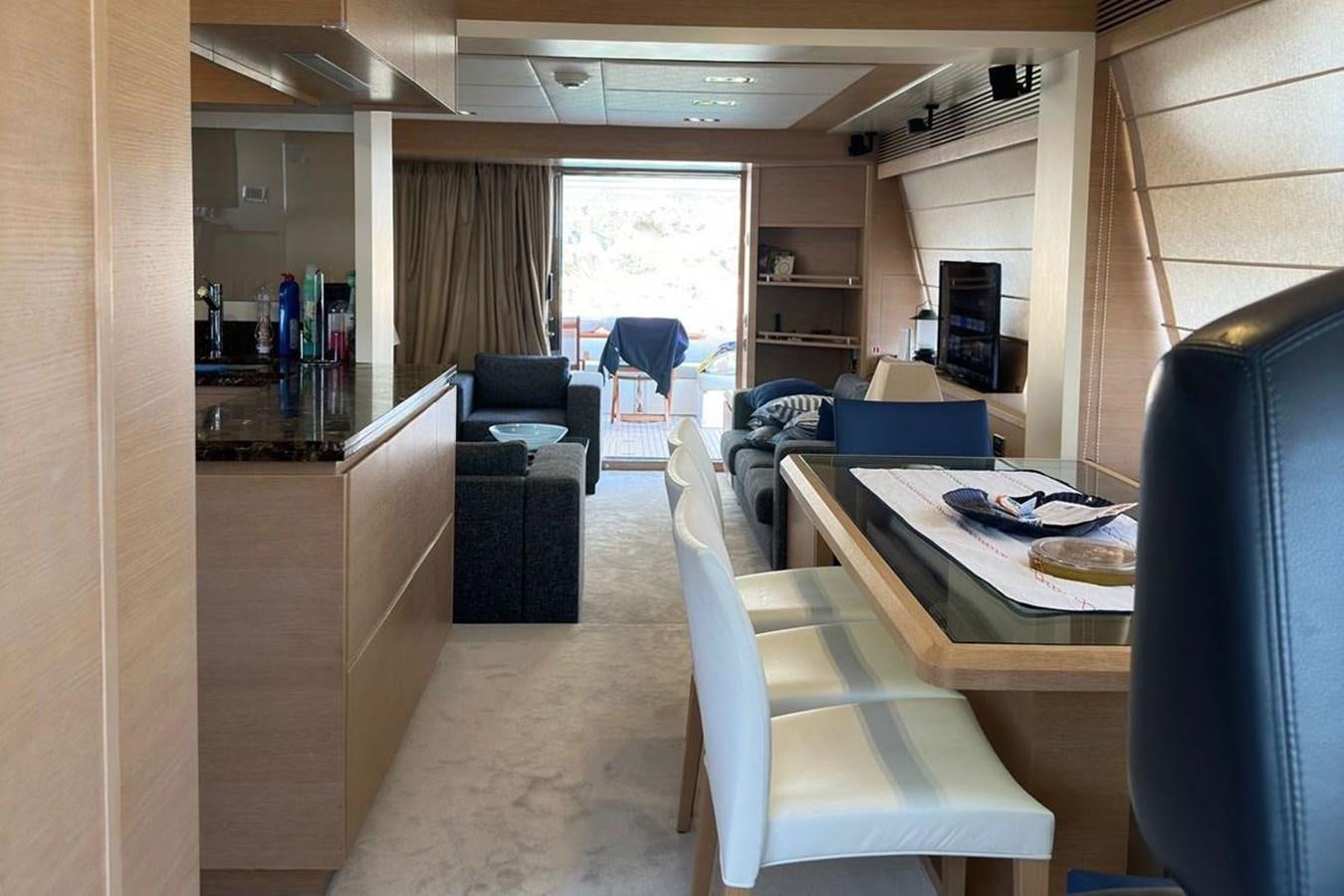 a room with a couch and a table aboard AZIMUT 84/12 Yacht for Sale