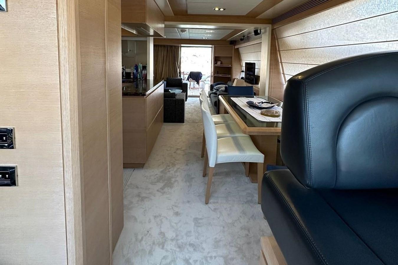 a room with chairs and a table aboard AZIMUT 84/12 Yacht for Sale