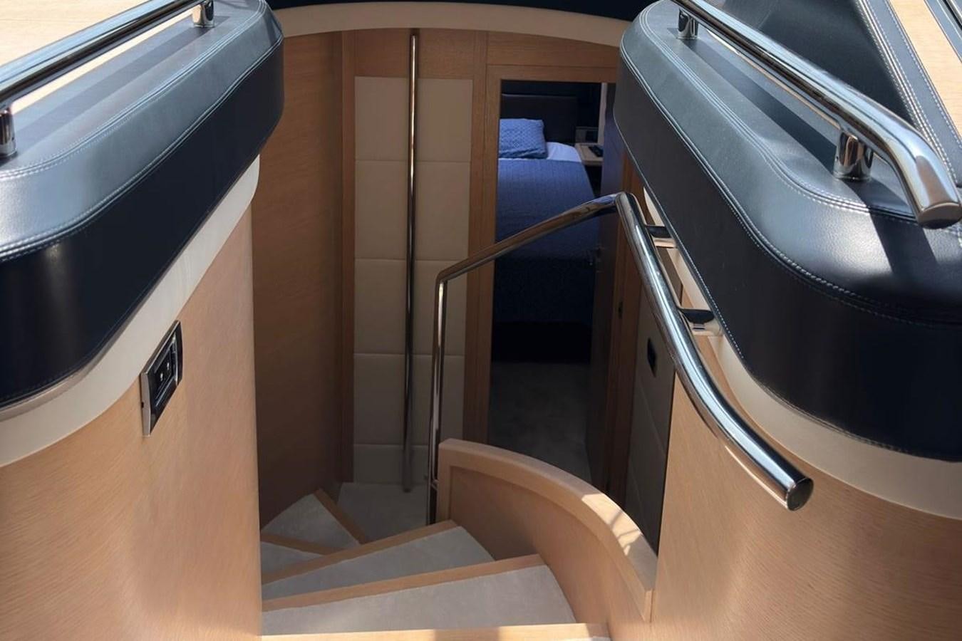 a black leather chair next to a black chair aboard AZIMUT 84/12 Yacht for Sale