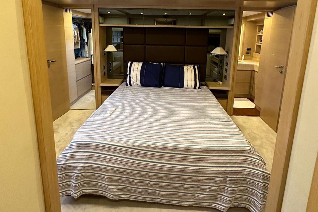 a bed in a room aboard AZIMUT 84/12 Yacht for Sale
