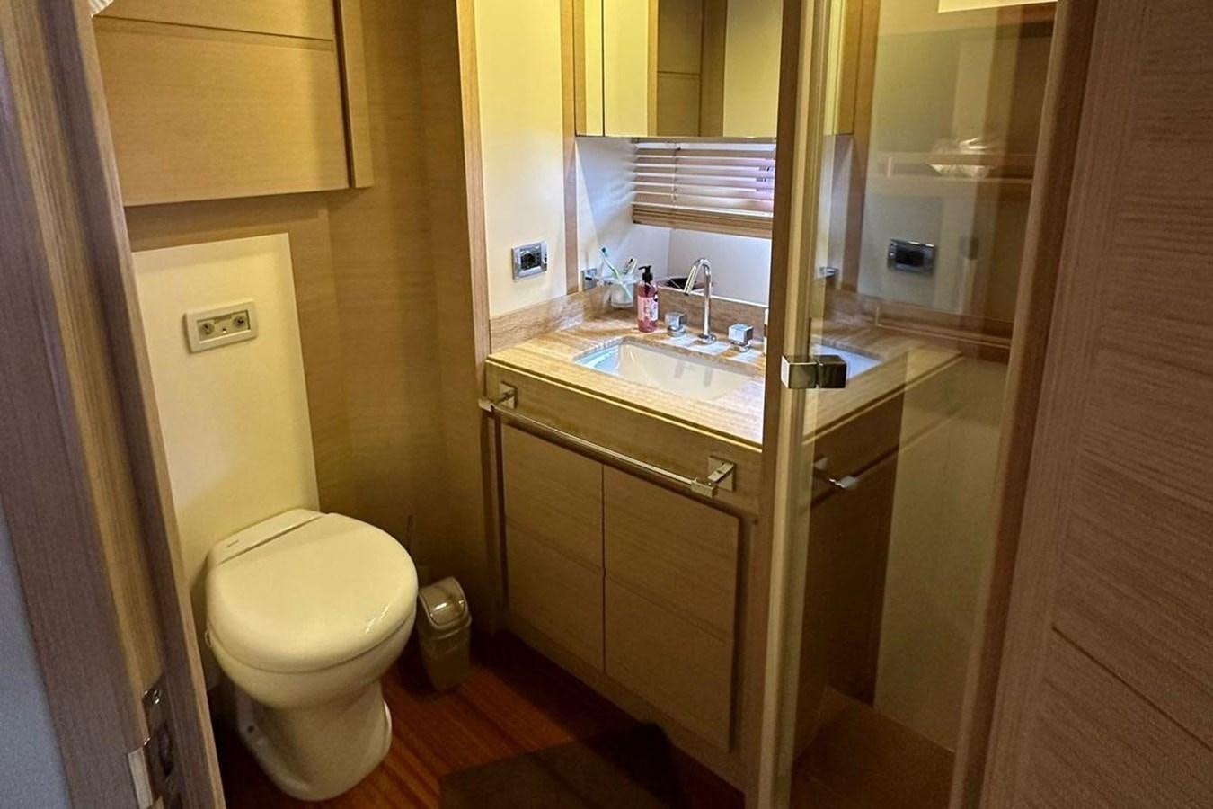 a bathroom with a sink and a toilet aboard AZIMUT 84/12 Yacht for Sale