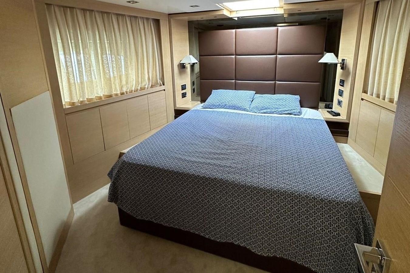 a bed in a room aboard AZIMUT 84/12 Yacht for Sale