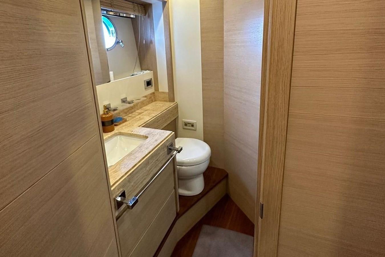 a bathroom with a toilet and sink aboard AZIMUT 84/12 Yacht for Sale