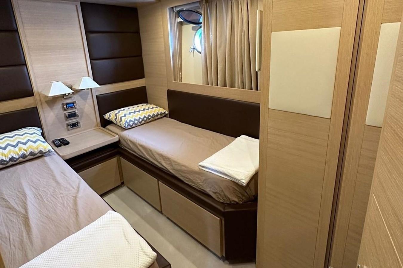 a room with beds and a telephone aboard AZIMUT 84/12 Yacht for Sale