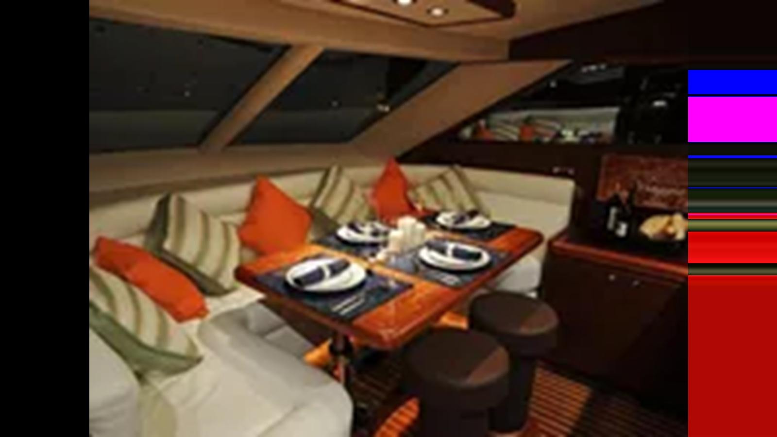 a bed with a desk and a television aboard 2009 HORIZON VISION 74 Yacht for Sale