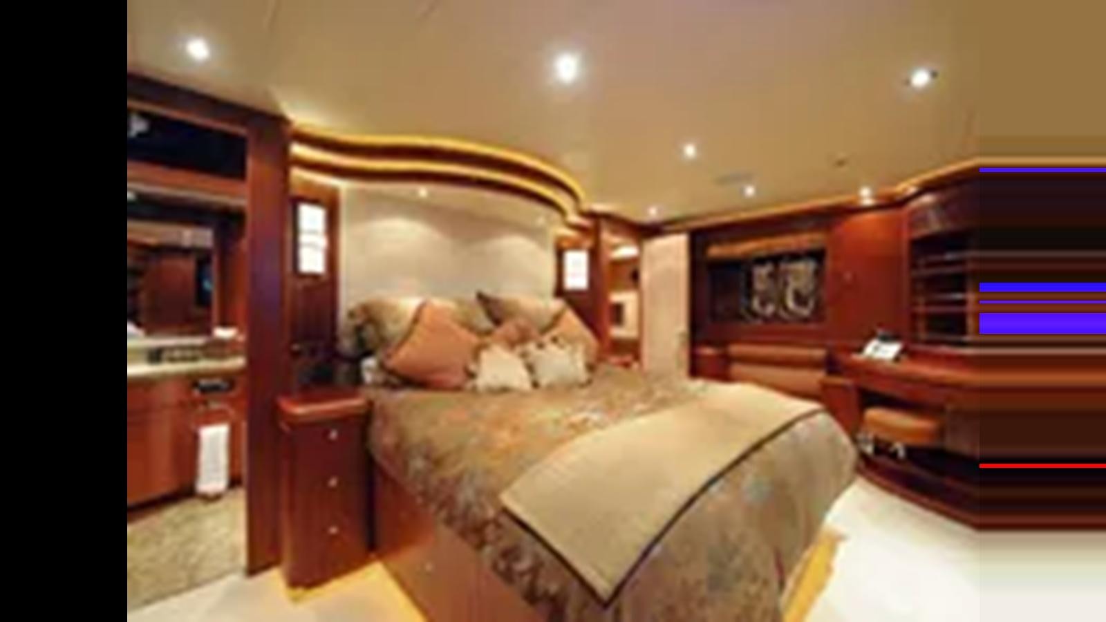 a bedroom with a bed and dresser aboard 2009 HORIZON VISION 74 Yacht for Sale