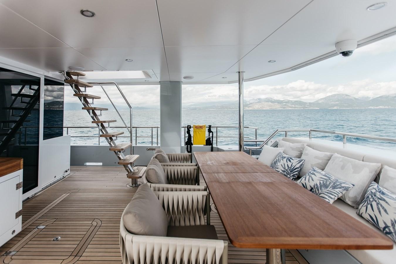 a large balcony overlooking a body of water aboard BERING 76  LEMANJA Yacht for Sale
