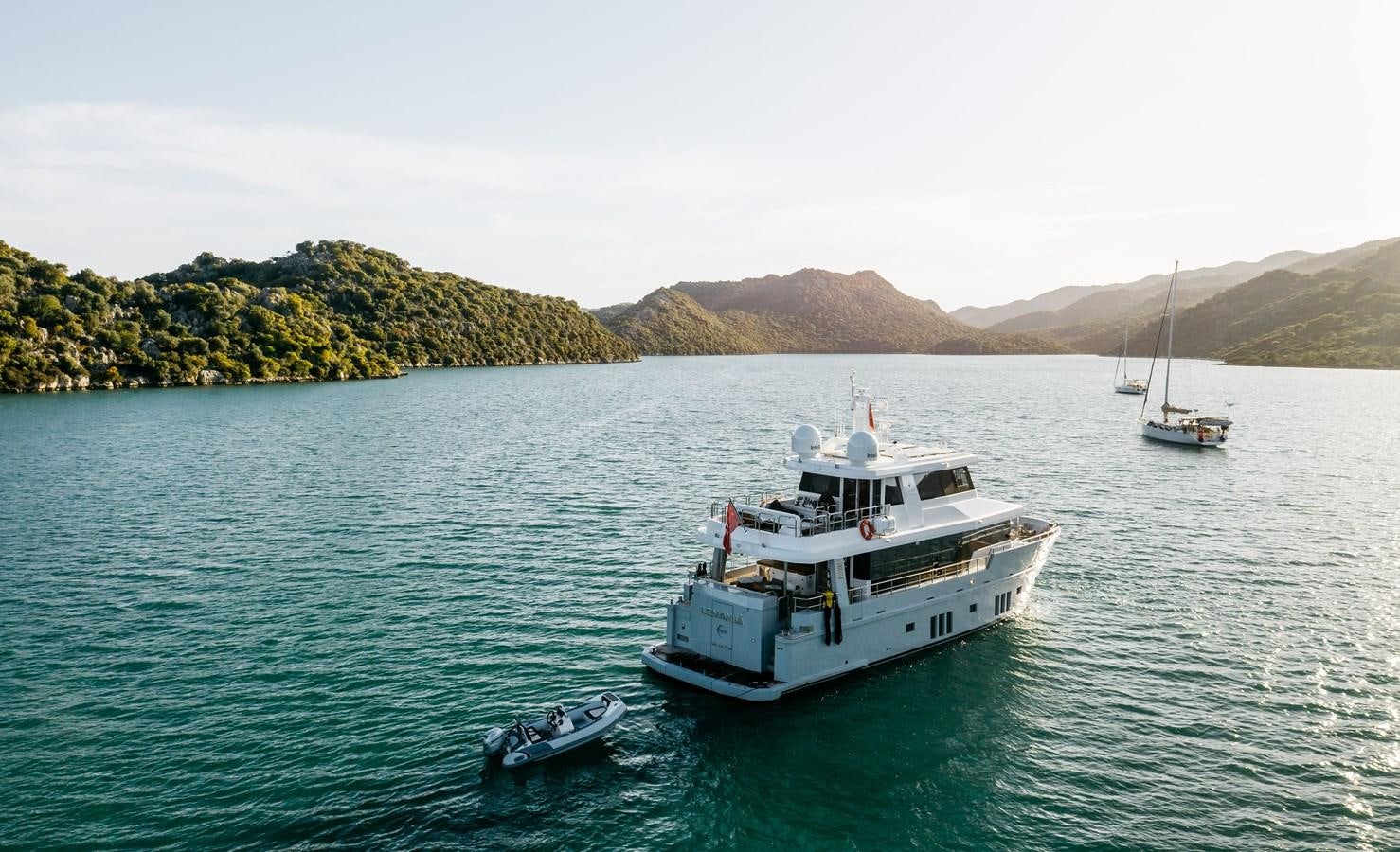 a couple of boats in the water aboard BERING 76  LEMANJA Yacht for Sale