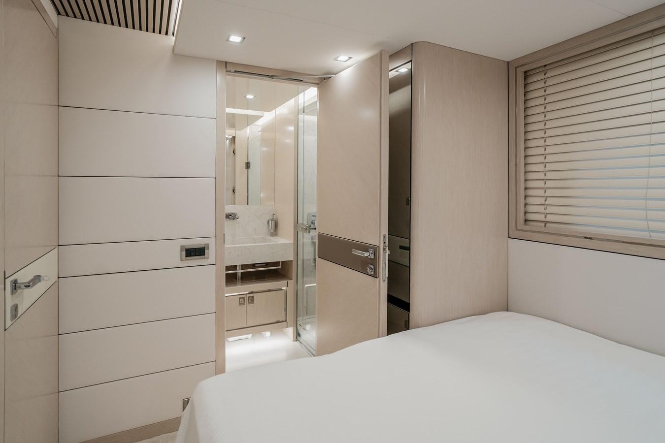 a white bathroom with a large mirror aboard BERING 76  LEMANJA Yacht for Sale