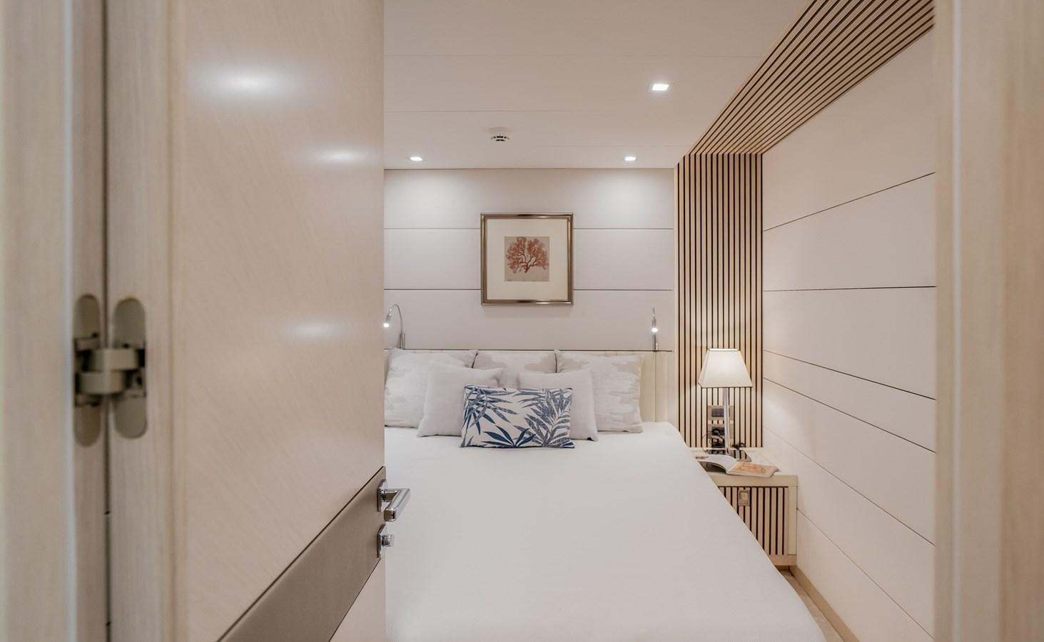a bed with a white sheet aboard BERING 76  LEMANJA Yacht for Sale