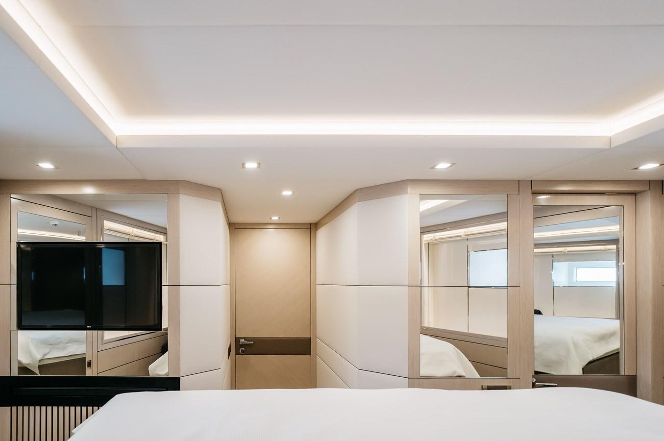 a room with a tv and a closet aboard BERING 76  LEMANJA Yacht for Sale
