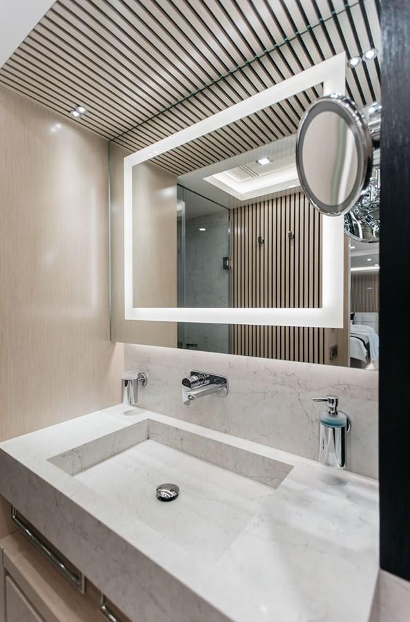 a bathroom with a large mirror aboard BERING 76  LEMANJA Yacht for Sale