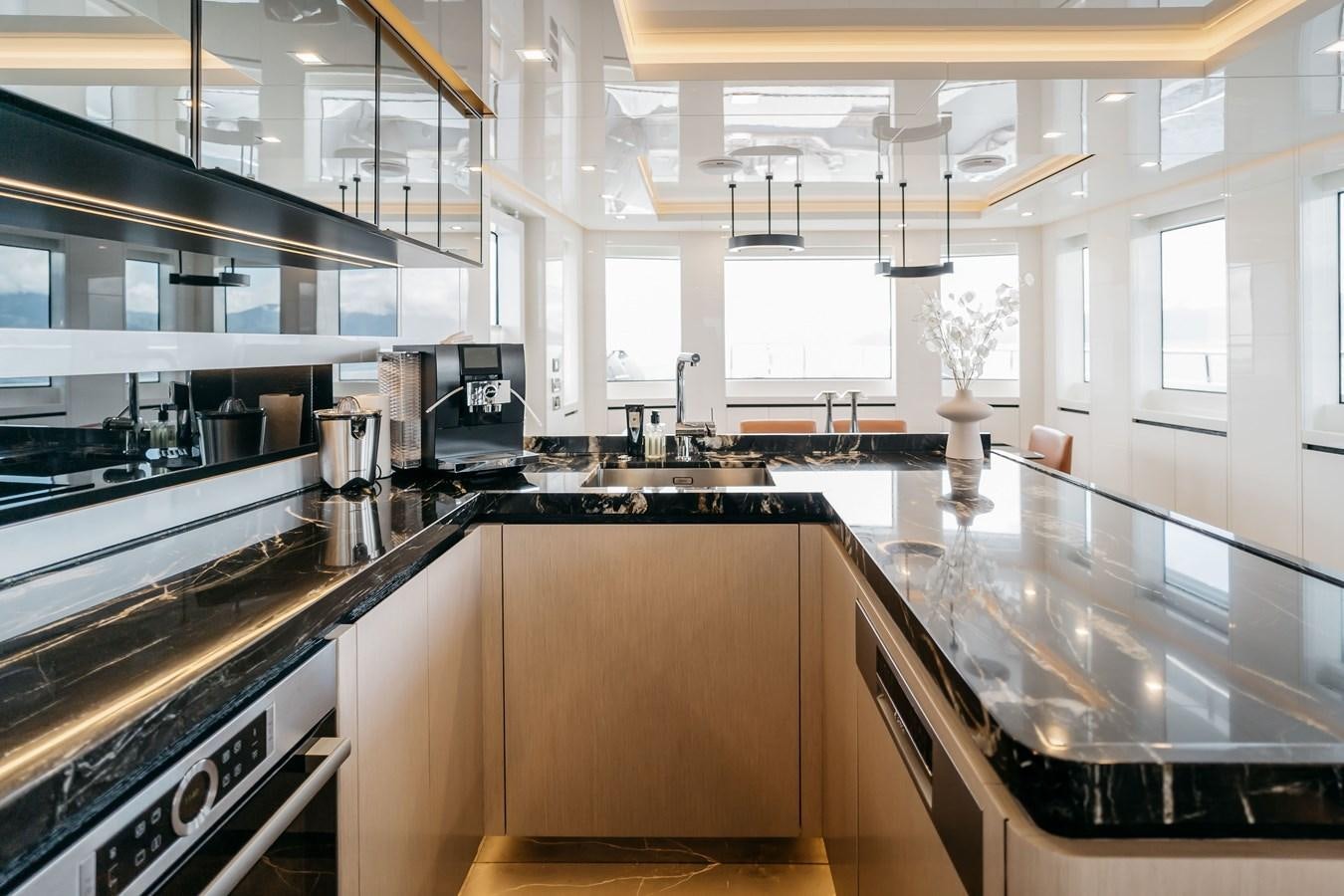 a kitchen with a large island aboard BERING 76  LEMANJA Yacht for Sale