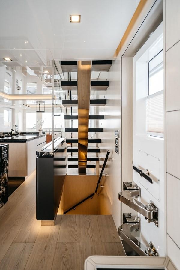a room with a ladder and shelves aboard BERING 76  LEMANJA Yacht for Sale