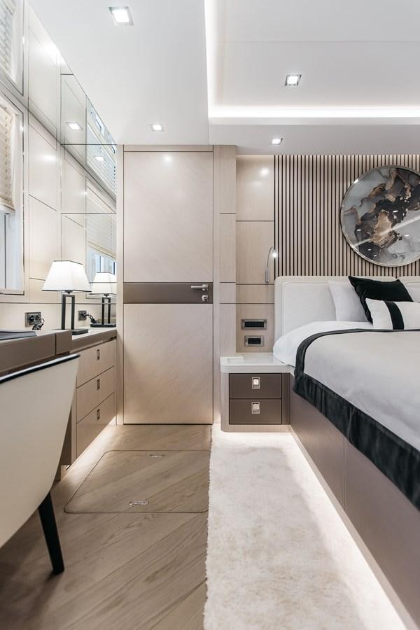 a bedroom with a large mirror aboard BERING 76  LEMANJA Yacht for Sale