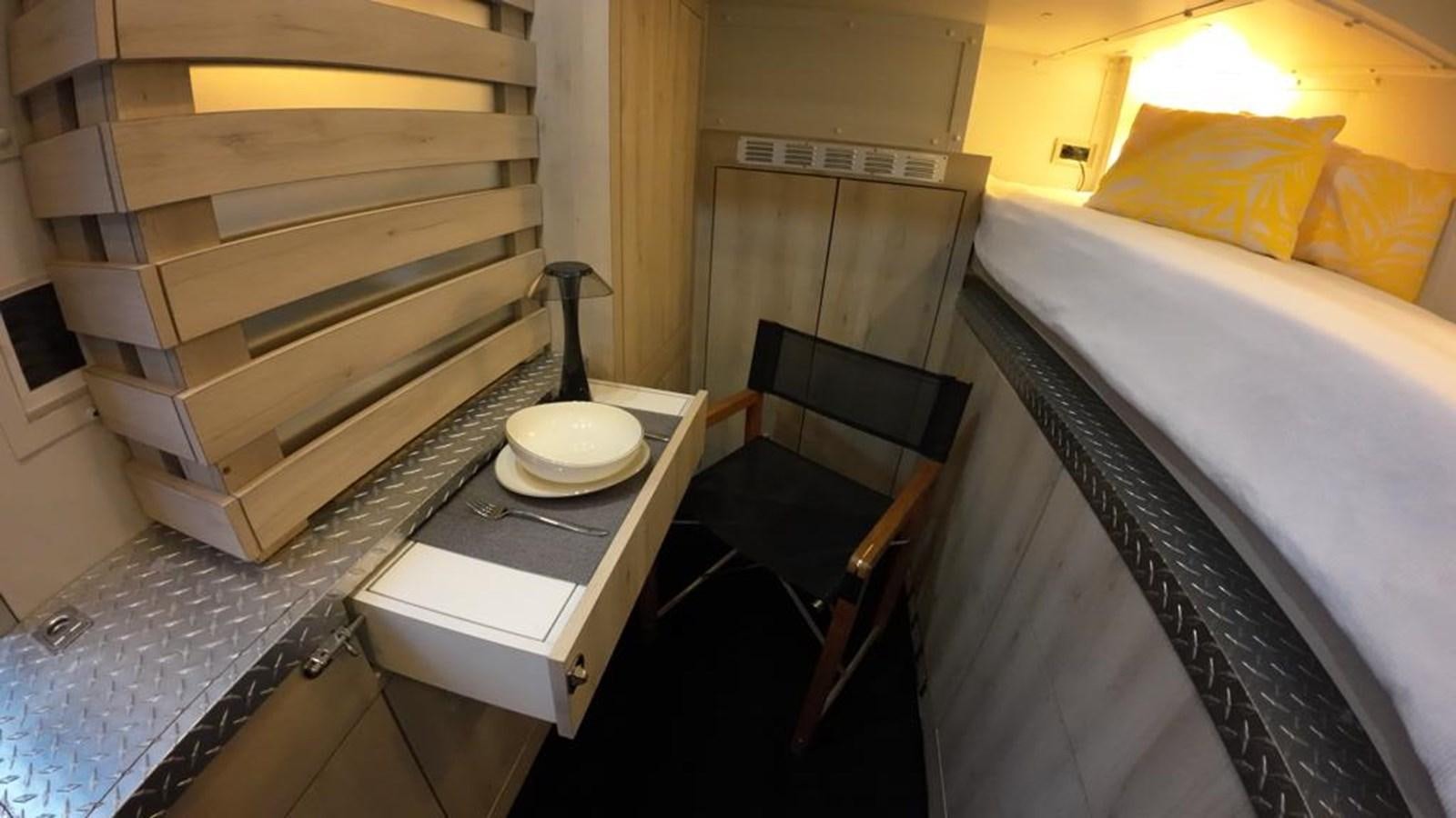 a bathroom with a sink and a bed aboard BERING 76  LEMANJA Yacht for Sale