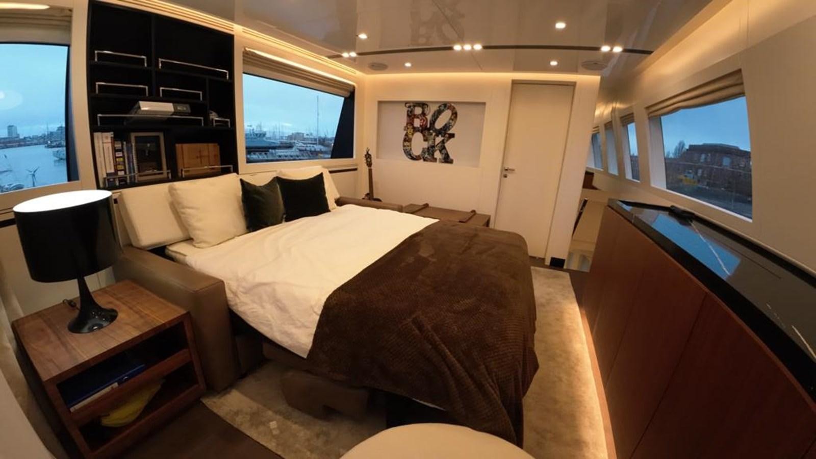 a bedroom with a large bed aboard BERING 76  LEMANJA Yacht for Sale