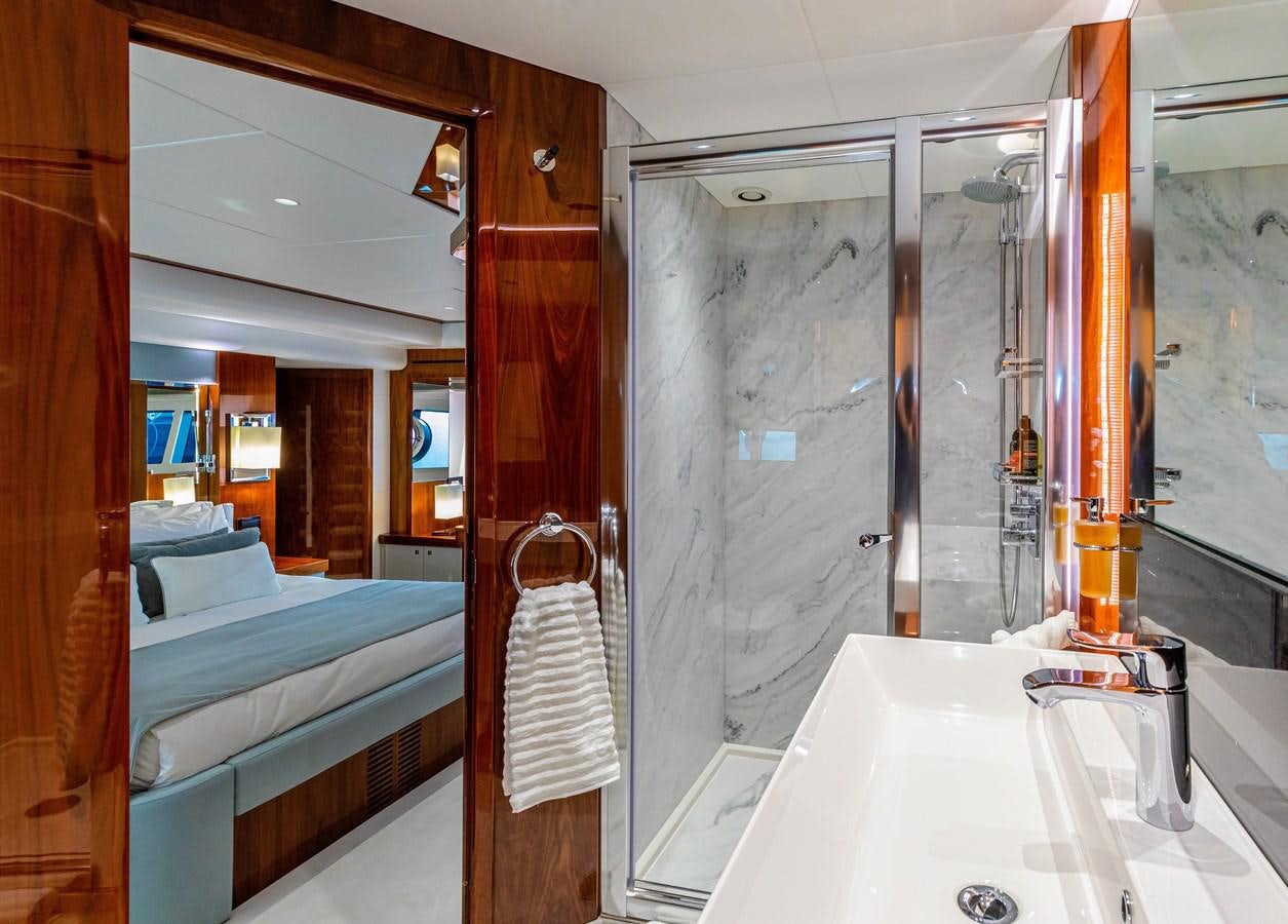 a bathroom with a sink and a bathtub aboard KUDOS Yacht for Sale