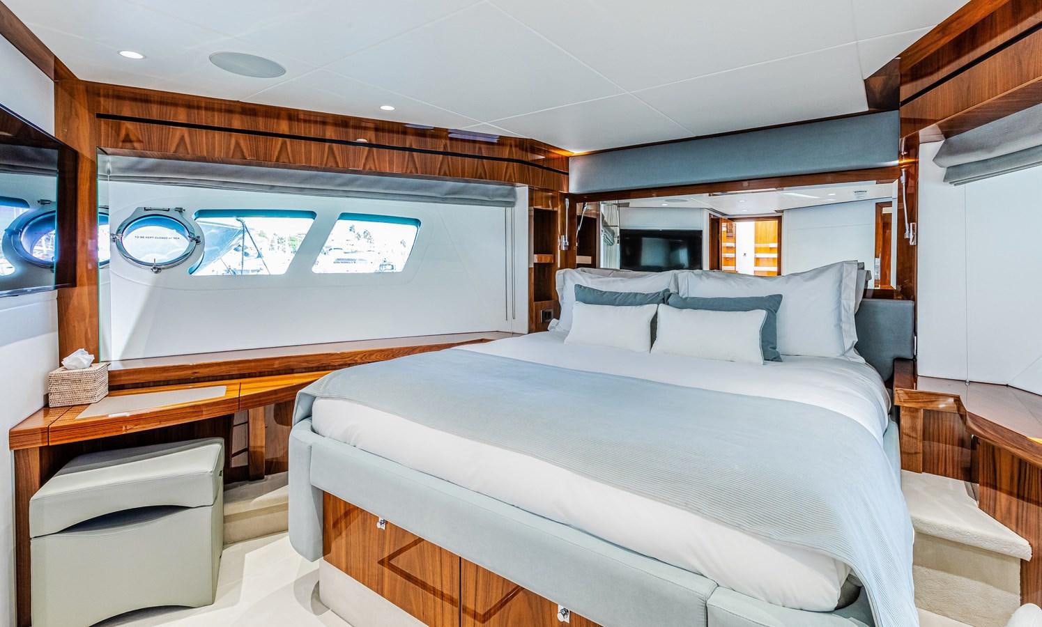 a bed in a room aboard KUDOS Yacht for Sale