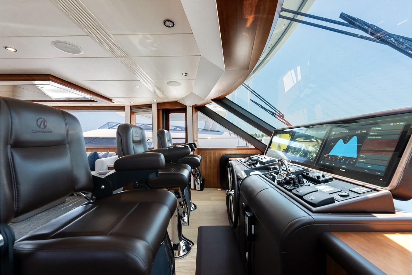 inside of a vehicle with seats and a view of the cockpit and the cockpit of a plane aboard WIGGLE ROOM Yacht for Sale