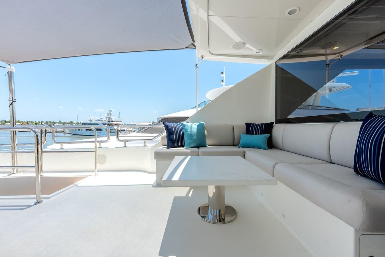 a white couch in a room aboard WIGGLE ROOM Yacht for Sale