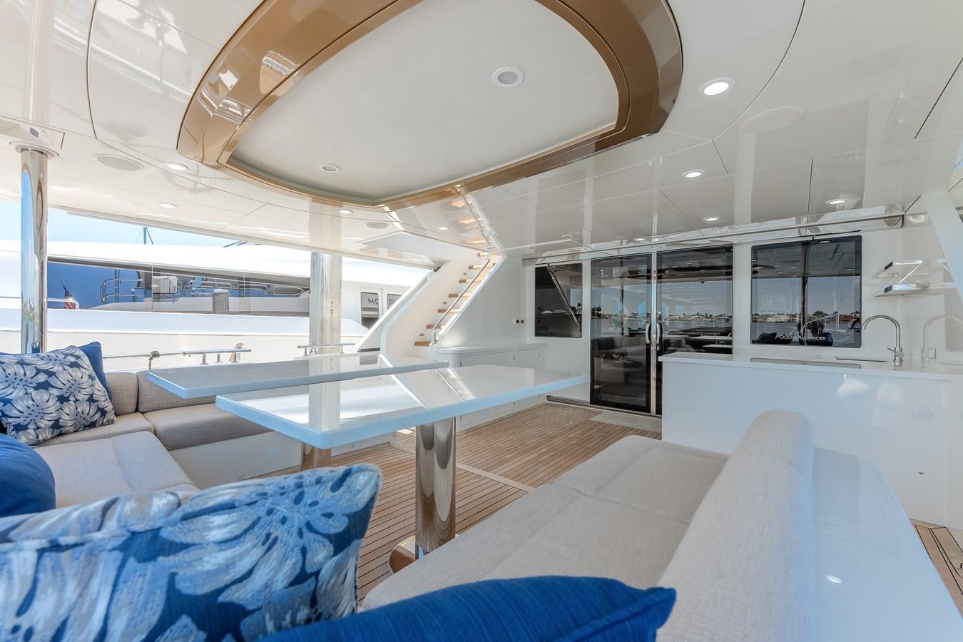 a room with a pool table and couches aboard WIGGLE ROOM Yacht for Sale