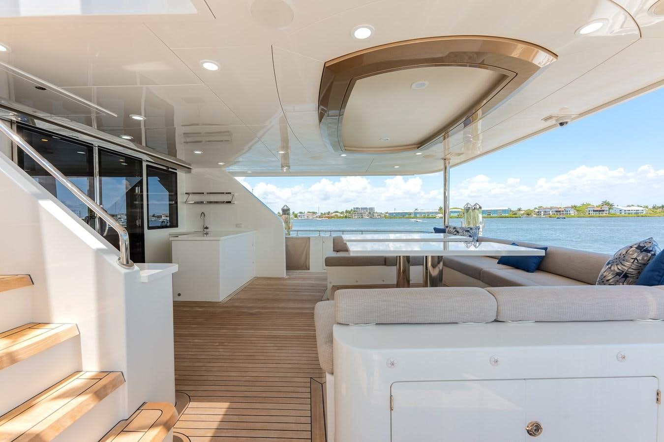 a room with a view of the water and the deck aboard WIGGLE ROOM Yacht for Sale
