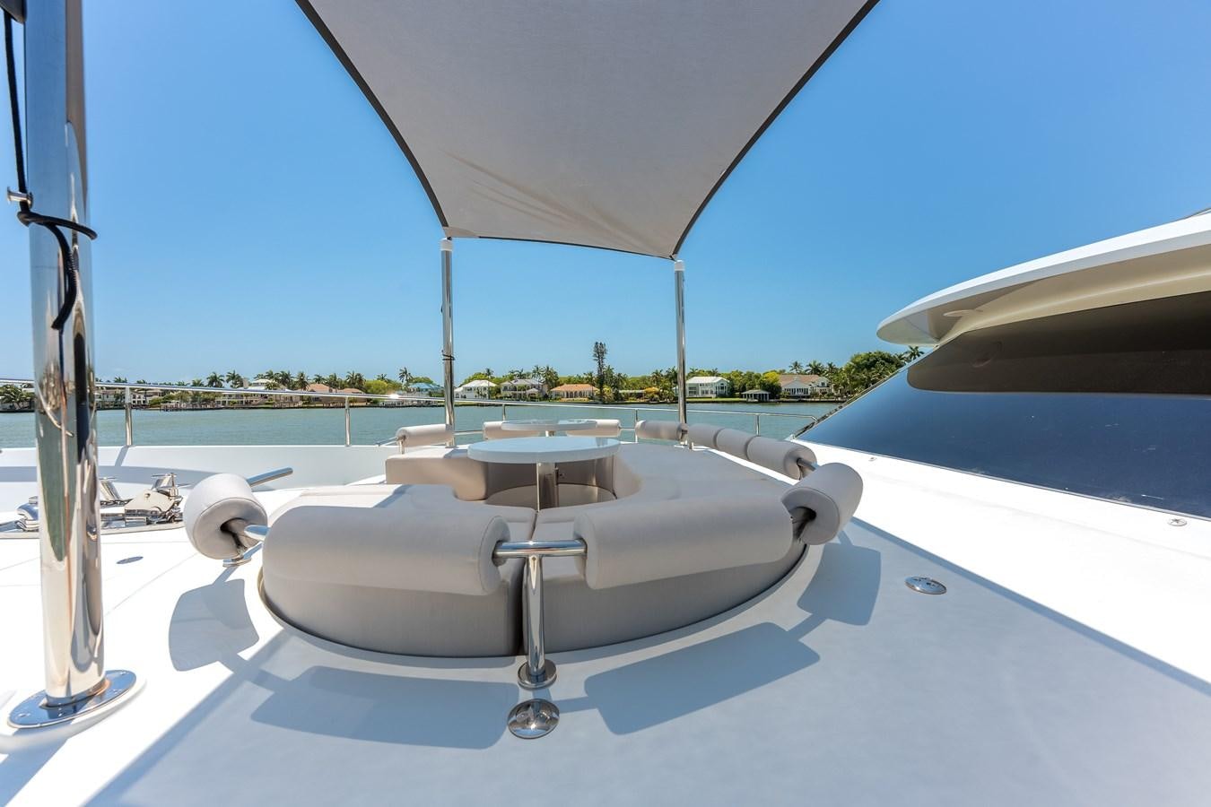 a white lounge chair on a boat aboard WIGGLE ROOM Yacht for Sale