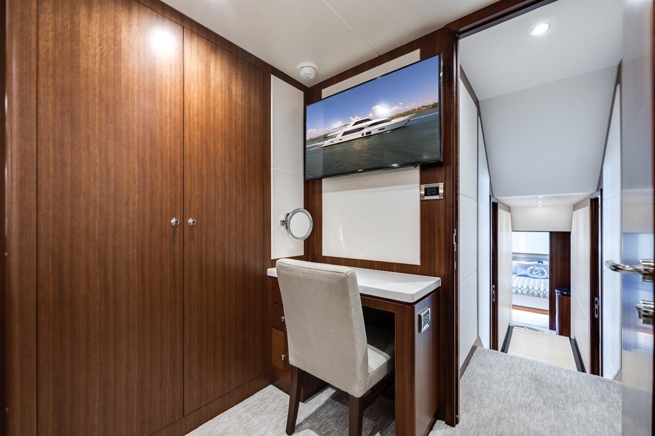 a room with a chair and a table aboard WIGGLE ROOM Yacht for Sale