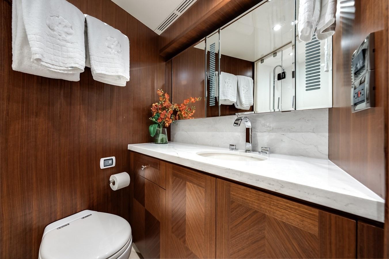 a bathroom with a sink and a toilet aboard WIGGLE ROOM Yacht for Sale