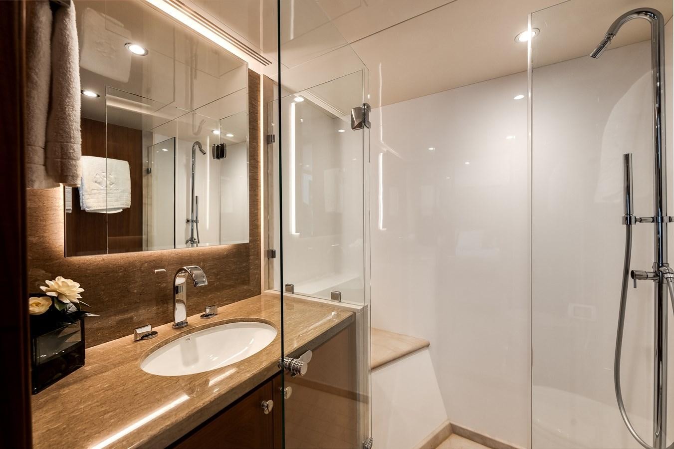 a bathroom with a large mirror aboard WIGGLE ROOM Yacht for Sale
