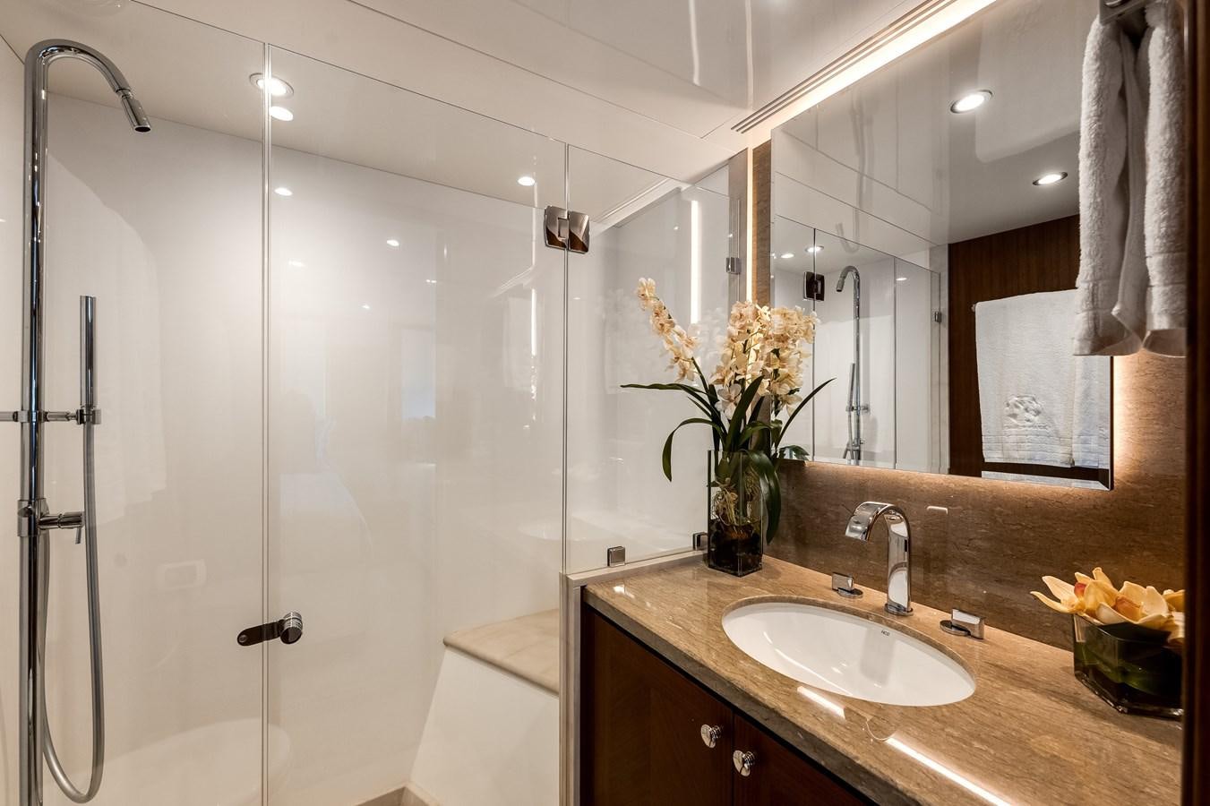 a bathroom with a glass shower aboard WIGGLE ROOM Yacht for Sale