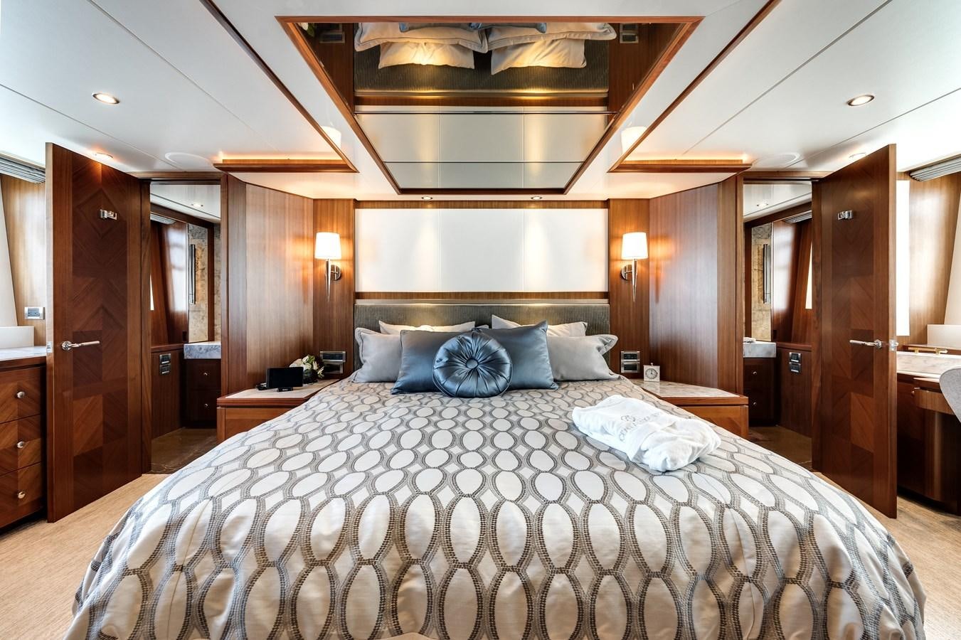 a large bed in a hotel room aboard WIGGLE ROOM Yacht for Sale